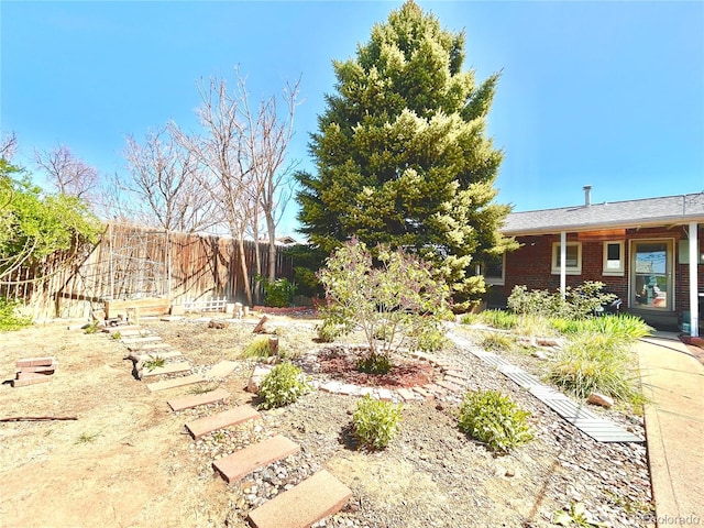 view of yard featuring fence
