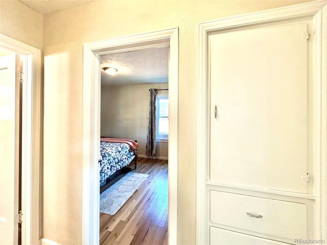 1965 Havana St, Aurora, CO 80010 - corridor featuring wood finished floors and baseboards