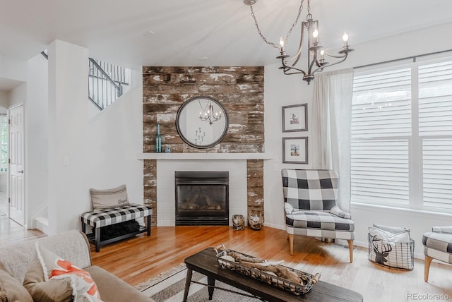 8367 Devinney St, Arvada, CO 80005 - living area featuring a chandelier, wood finished floors, and plenty of natural light