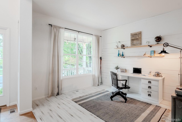 8367 Devinney St, Arvada, CO 80005 - home office with light wood-type flooring and built in desk