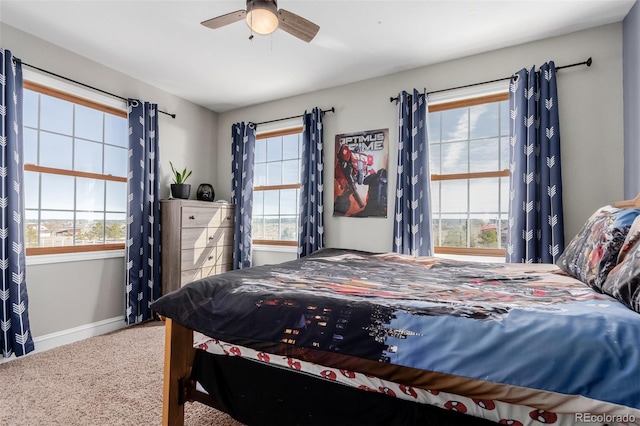 carpeted bedroom with baseboards and ceiling fan