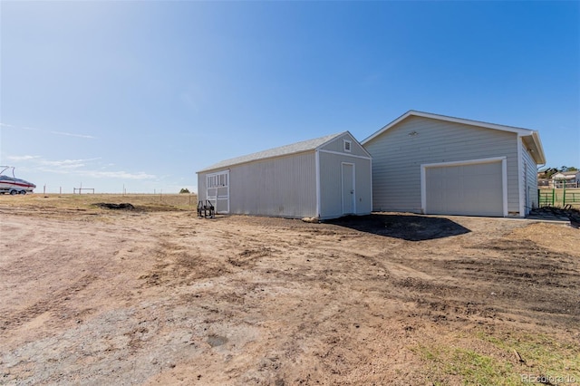 view of outbuilding featuring an outdoor structure and driveway