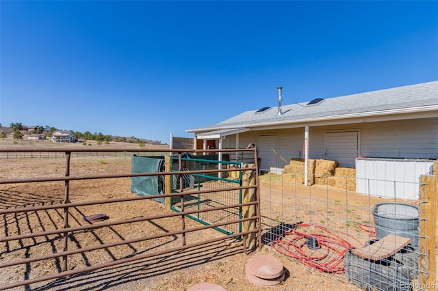 view of yard featuring an exterior structure and an outdoor structure