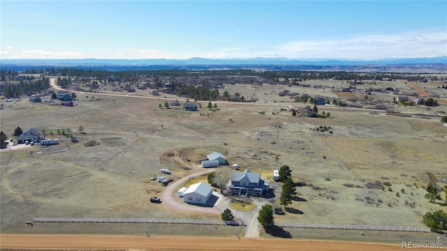 drone / aerial view featuring a rural view and a mountain view