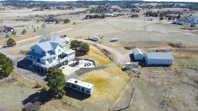 birds eye view of property featuring a rural view