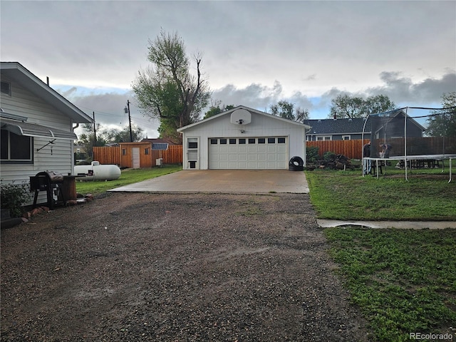 24797 Pleasant Hill Ave, Galeton, CO 80622 - detached garage with a trampoline and a storage unit