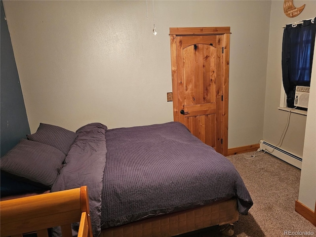 24797 Pleasant Hill Ave, Galeton, CO 80622 - bedroom featuring baseboard heating, carpet, and baseboards