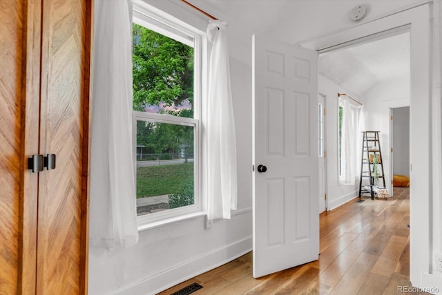 211 E Emma St, Lafayette, CO 80026 - foyer with baseboards, light wood-type flooring, and lofted ceiling