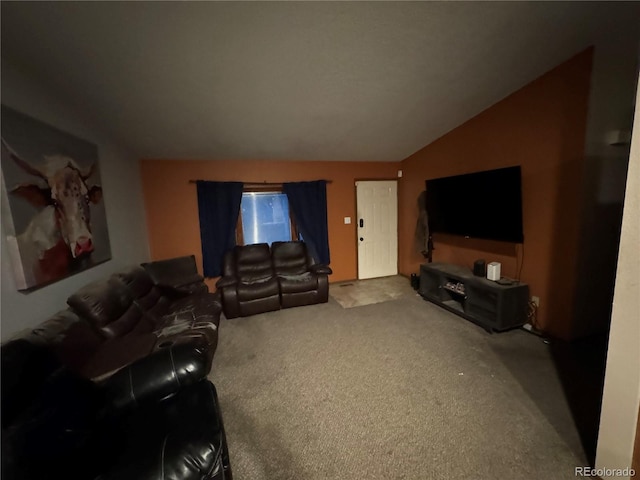 living room featuring carpet floors and vaulted ceiling