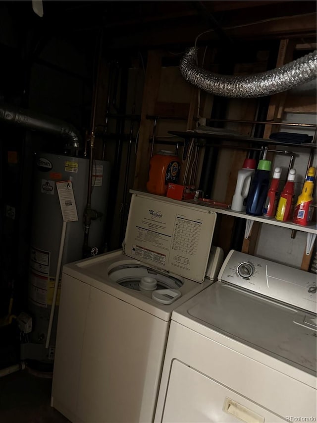 laundry area featuring washing machine and clothes dryer and gas water heater