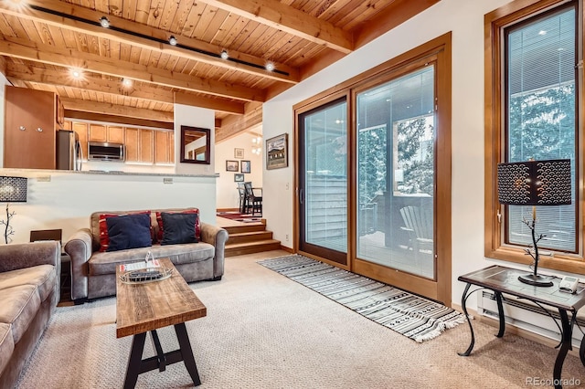 living room with beamed ceiling, light carpet, baseboard heating, and wooden ceiling