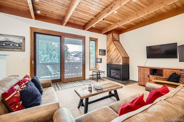 living room with beamed ceiling, a large fireplace, a baseboard radiator, and wood ceiling