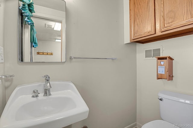 bathroom with toilet and sink