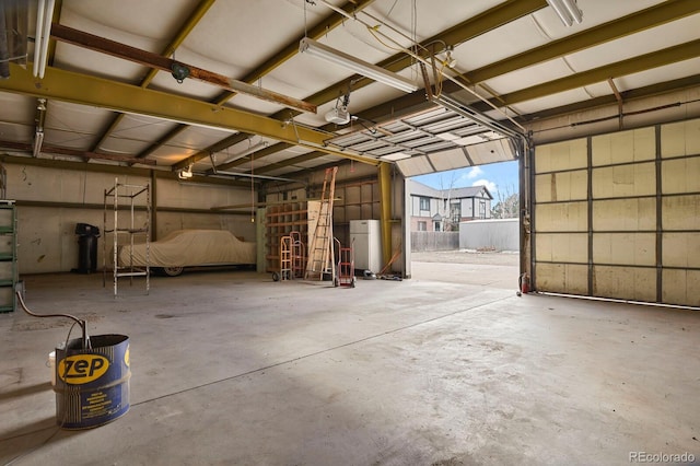 garage with white fridge and a garage door opener