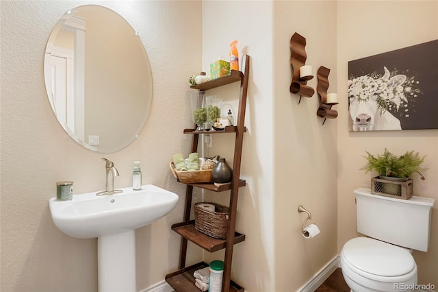 bathroom featuring toilet