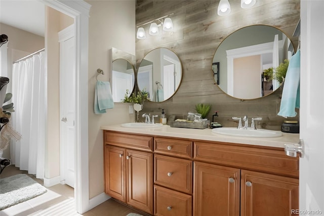 bathroom with a sink and double vanity