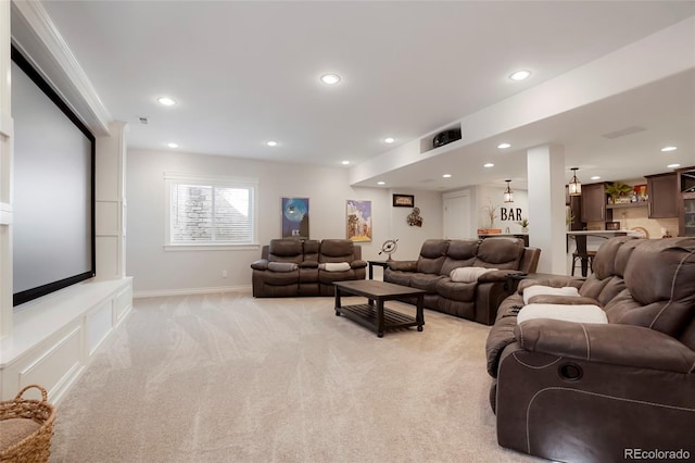 living room featuring recessed lighting, baseboards, and light colored carpet