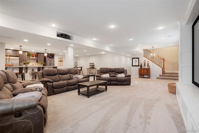 living room with recessed lighting, light carpet, and stairway
