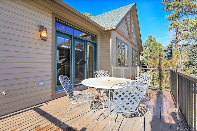 deck featuring outdoor dining area