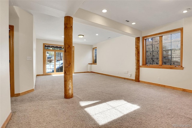 unfurnished room with light carpet, visible vents, baseboards, and recessed lighting