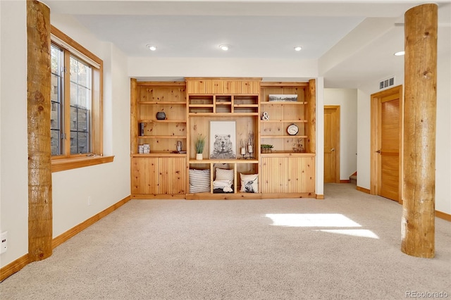 interior space featuring baseboards, recessed lighting, visible vents, and light colored carpet