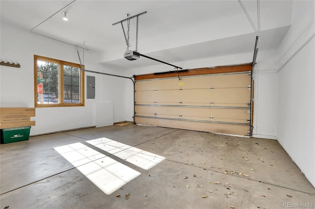 garage with electric panel and a garage door opener