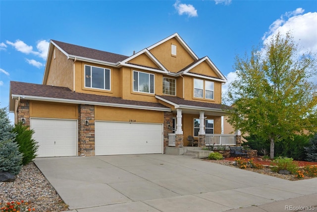 craftsman house featuring covered porch and a garage