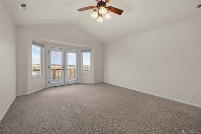 unfurnished room with french doors, light colored carpet, ceiling fan, and lofted ceiling