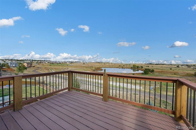 wooden deck featuring a water view