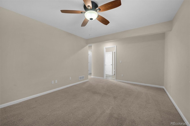 empty room featuring ceiling fan and carpet floors