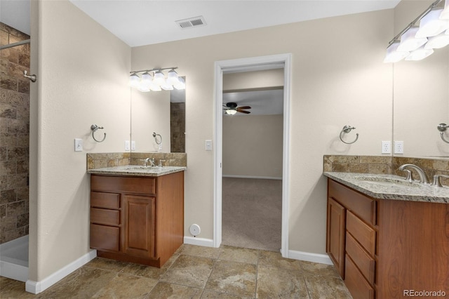 bathroom featuring ceiling fan, a shower, and vanity