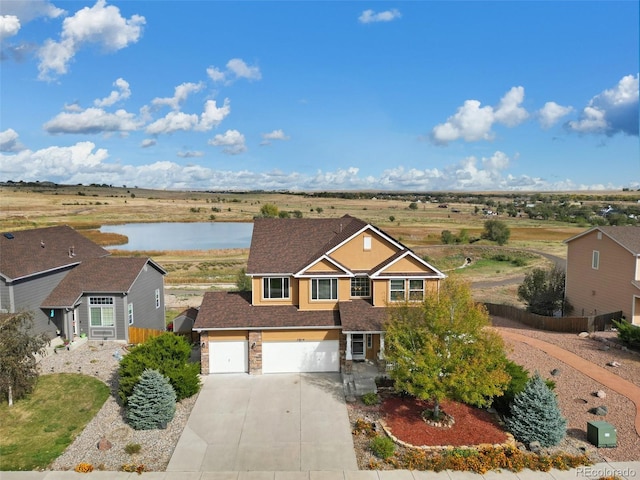 view of front of house featuring a water view and a garage