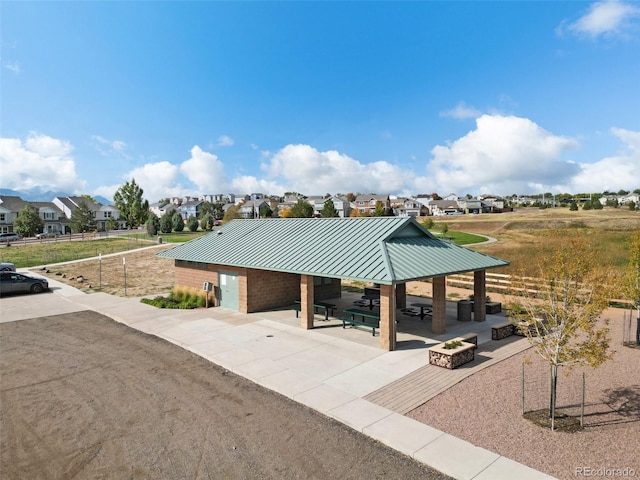 view of home's community featuring a patio and an outdoor fire pit