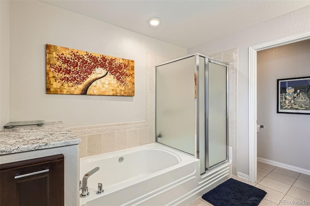 8300 Fairmount Dr Unit Aa102, Denver, CO 80247 - full bathroom with a shower stall, tile patterned flooring, and a bath
