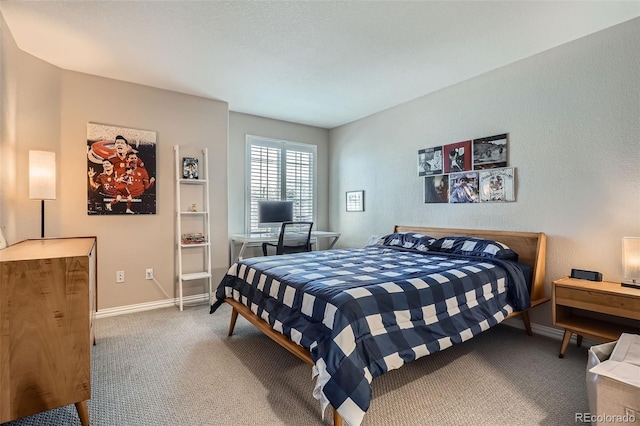 8300 Fairmount Dr Unit Aa102, Denver, CO 80247 - carpeted bedroom with baseboards and a desk