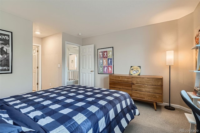 8300 Fairmount Dr Unit Aa102, Denver, CO 80247 - carpeted bedroom featuring baseboards