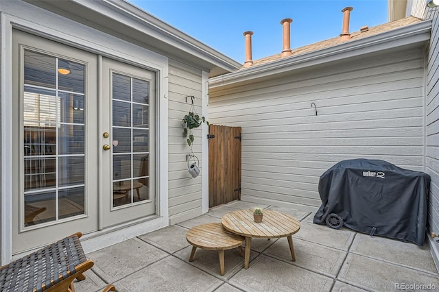 8300 Fairmount Dr Unit Aa102, Denver, CO 80247 - view of patio / terrace featuring french doors and a grill