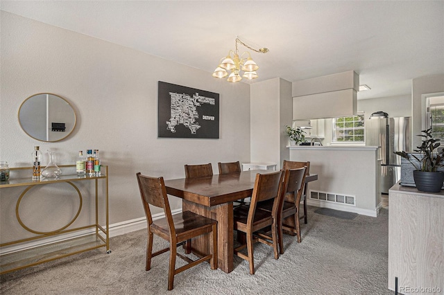 8259 S Fillmore Cir, Centennial, CO 80122 - carpeted dining space featuring a chandelier and baseboards