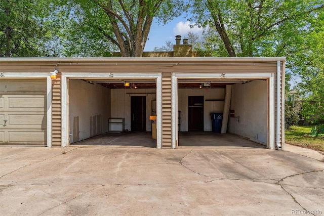 garage with concrete driveway