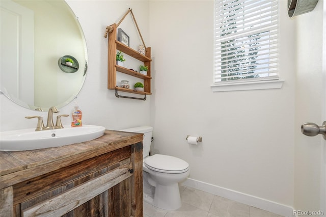 bathroom featuring vanity, toilet, and tile patterned floors