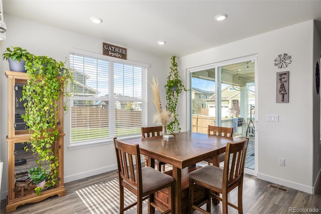 dining space featuring dark hardwood / wood-style floors and a wealth of natural light