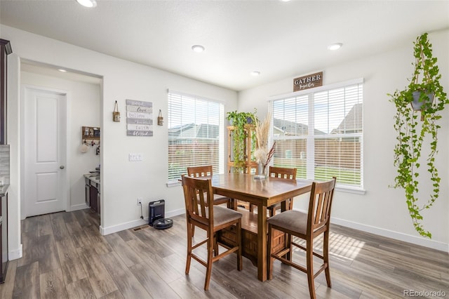 dining space featuring hardwood / wood-style flooring