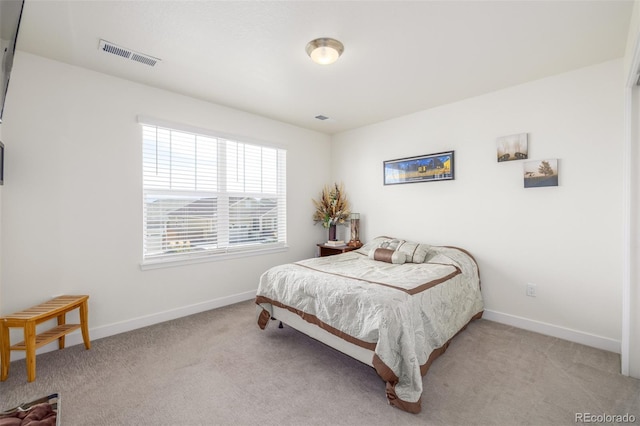 bedroom featuring light carpet