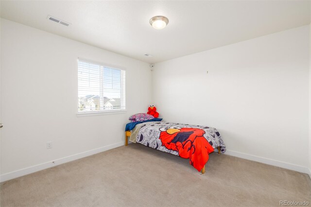 bedroom with light carpet