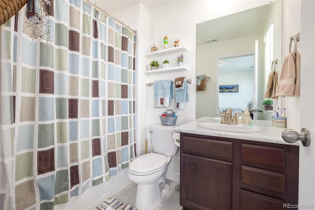 full bathroom with toilet, shower / bath combo with shower curtain, vanity, and tile patterned floors