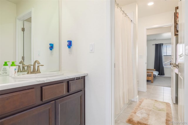 bathroom with vanity and tile patterned flooring