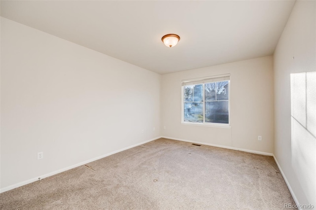 unfurnished room featuring carpet