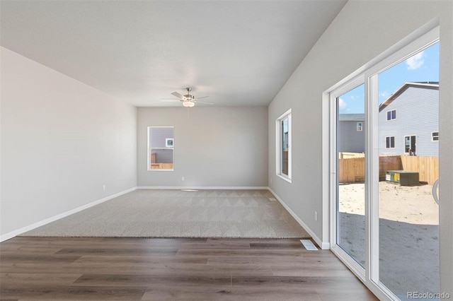 7303 Dolores Ave, Frederick, CO 80530 - carpeted spare room featuring wood finished floors, a ceiling fan, and baseboards
