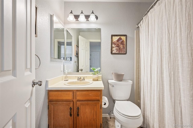 3600 S Pierce St Unit 1-207, Denver, CO 80235 - full bath featuring toilet, vanity, a textured wall, and a shower with shower curtain
