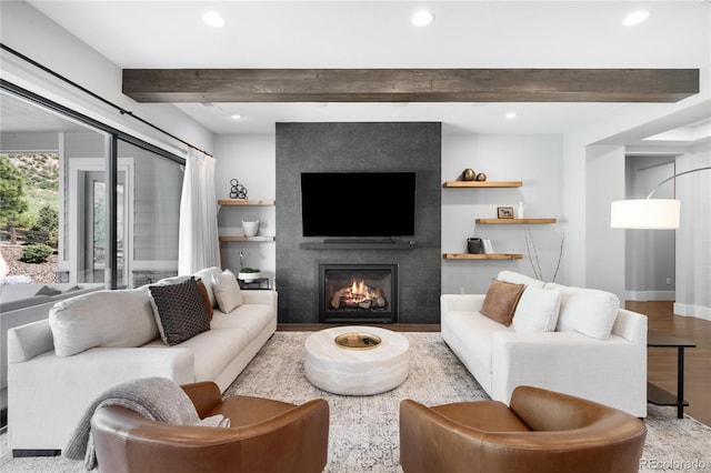 4868 Hogback Ridge Rd, Morrison, CO 80465 - living room with beam ceiling, wood finished floors, recessed lighting, a tile fireplace, and baseboards